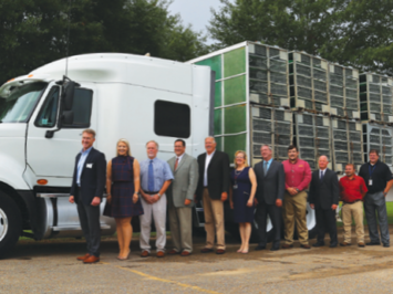 Employees in front of truck