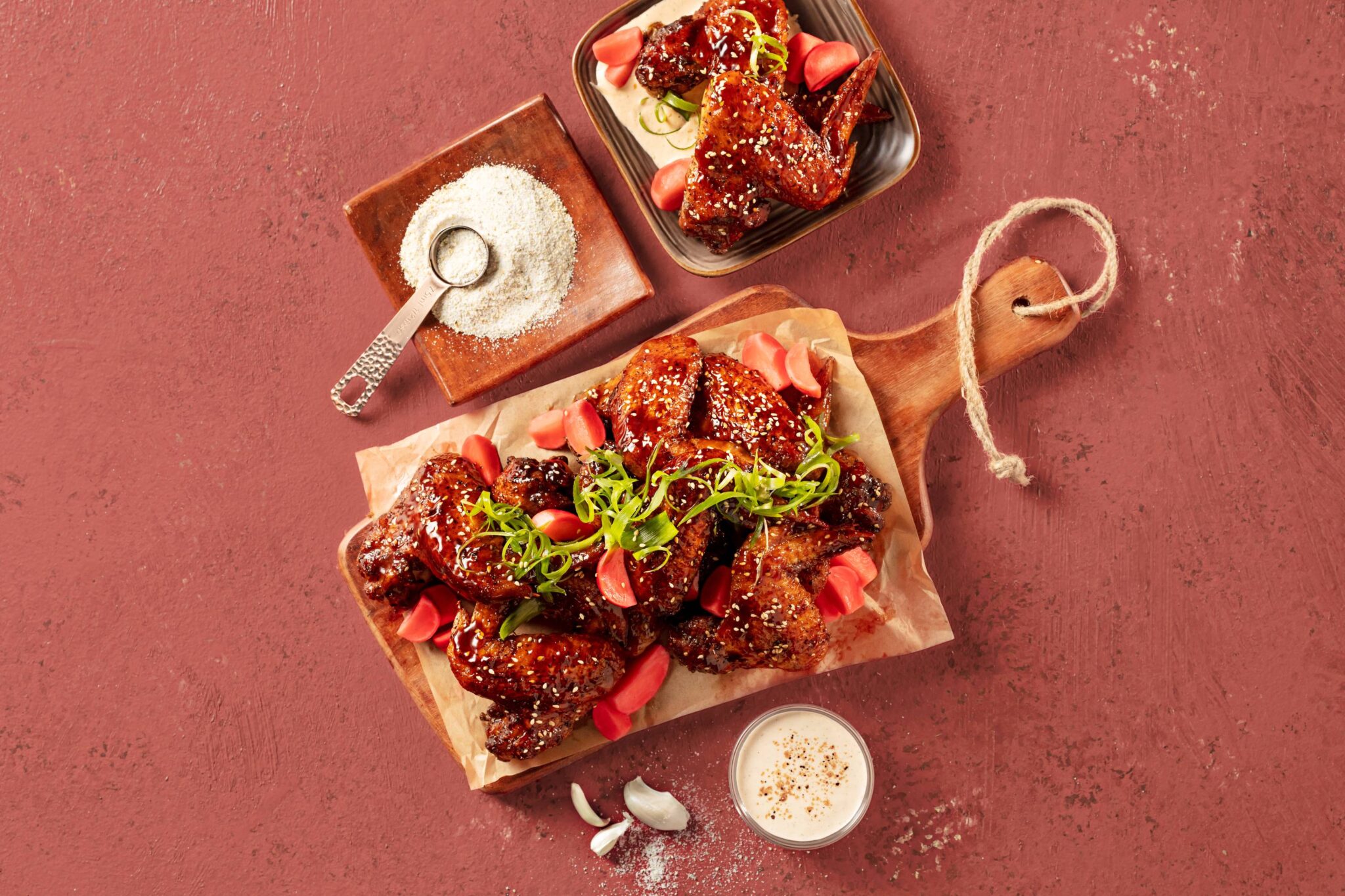 Airfried sticky Korean-style chicken wings glazed with soy sauce, sprinkled with sesame seeds and scallions.